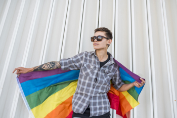 Person holding lgbt flag Free Photo.